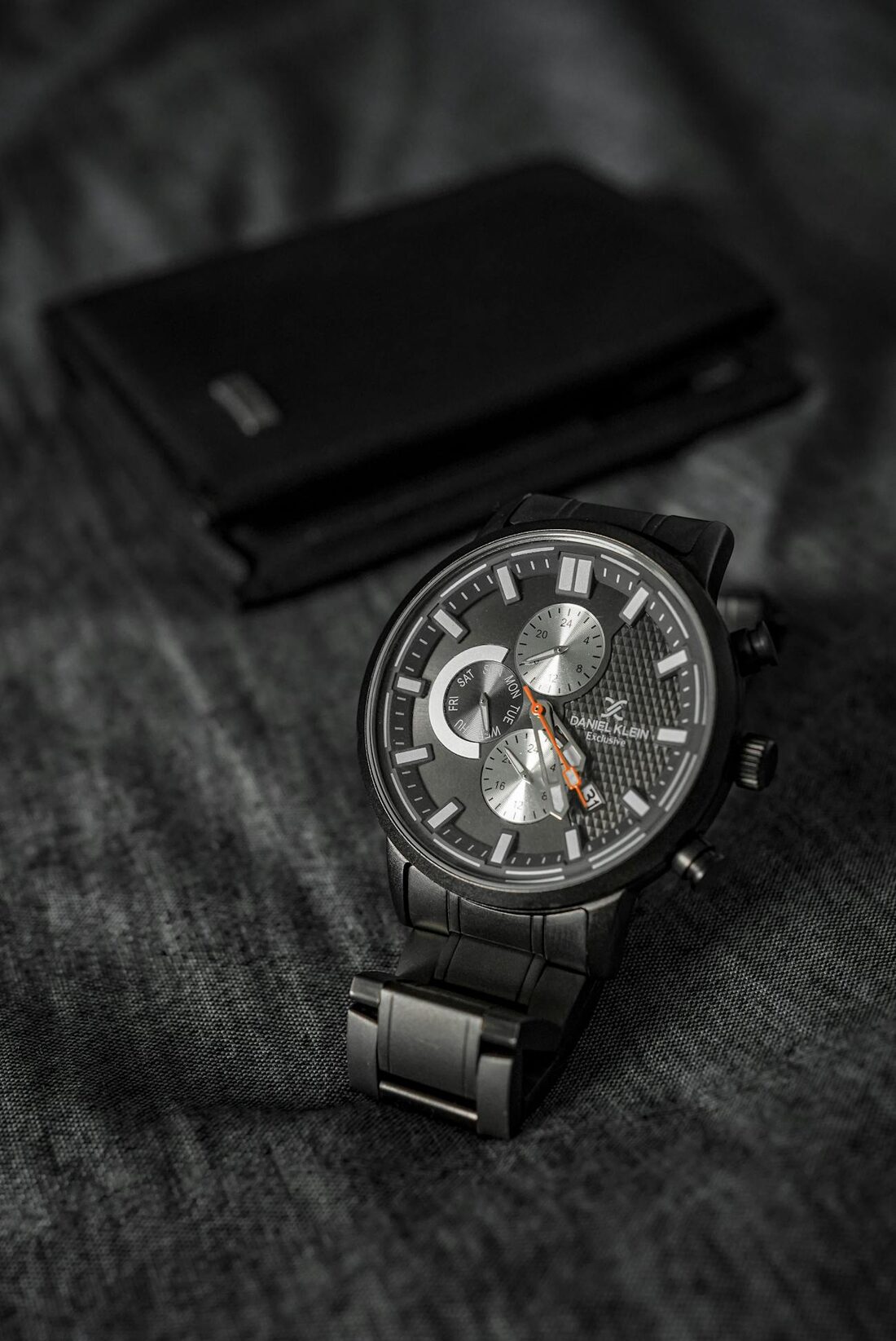 Luxury wristwatch on dark fabric